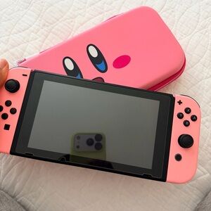 Pink Nintendo Switch Console with Kirby Case